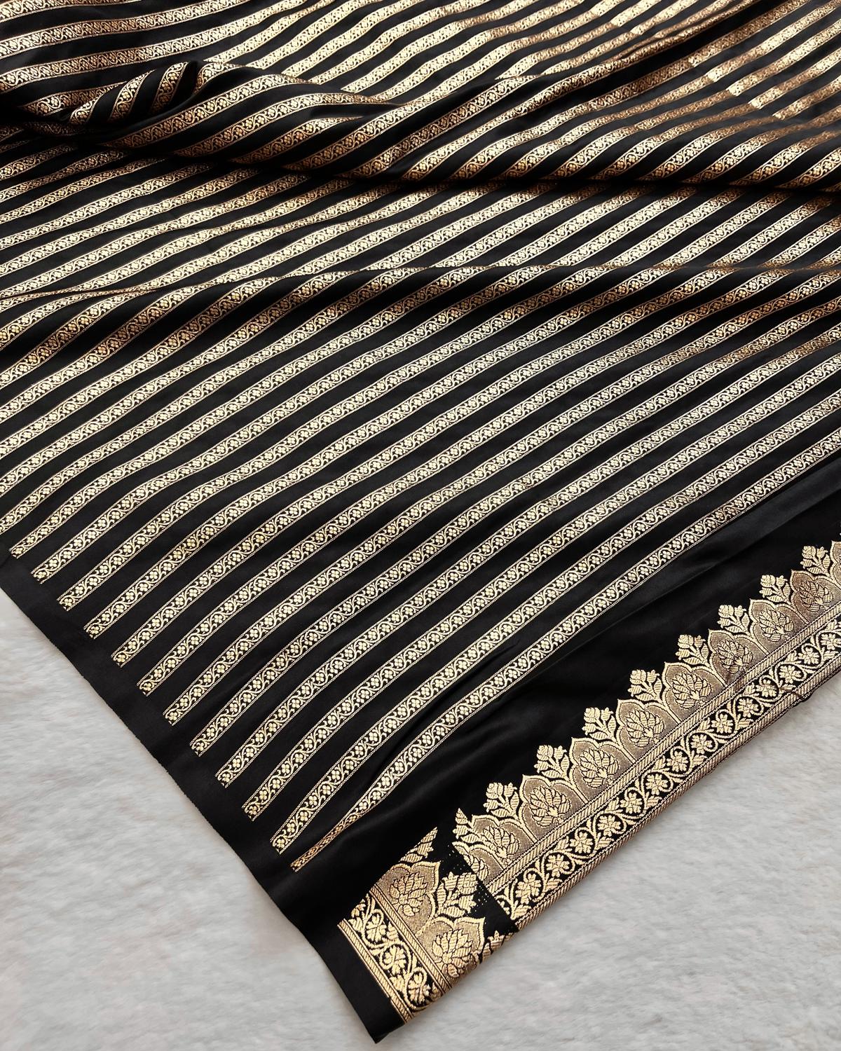 Matching zari woven black blouse piece with gold stripes and zari border on black saree- Niyarah | Buy new design black saree