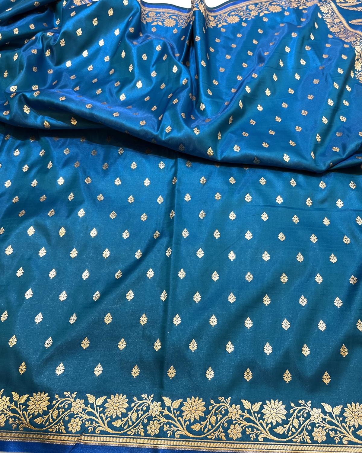 Blue saree with gold booti patterns