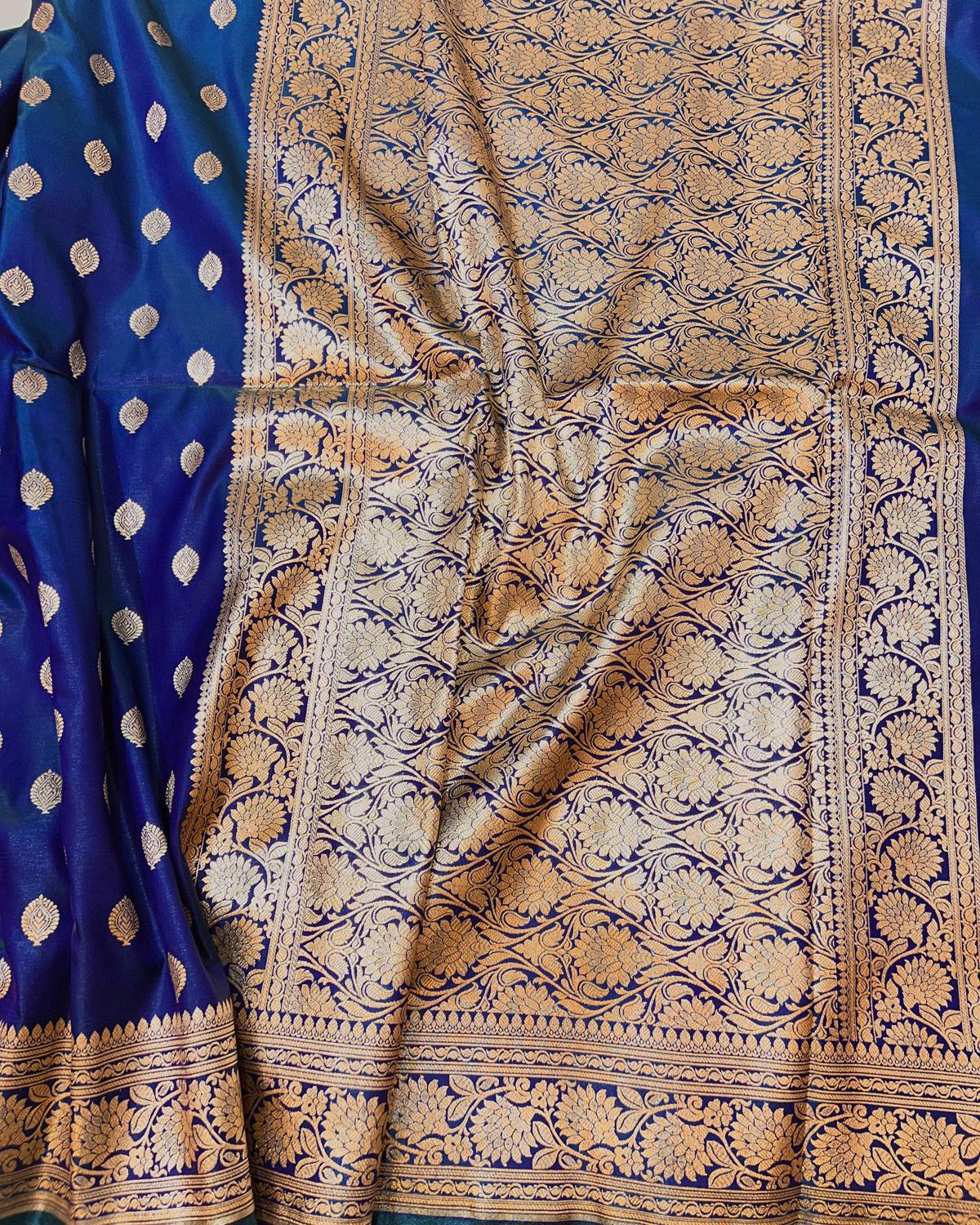 Blue and gold patterned fabric with intricate designs