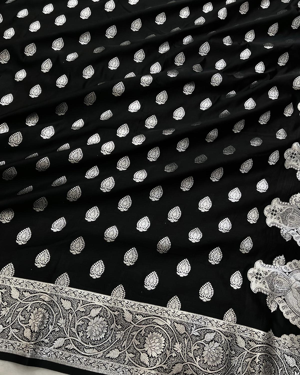 detailed body design on black silk saree with silver zari buti-Niyarah