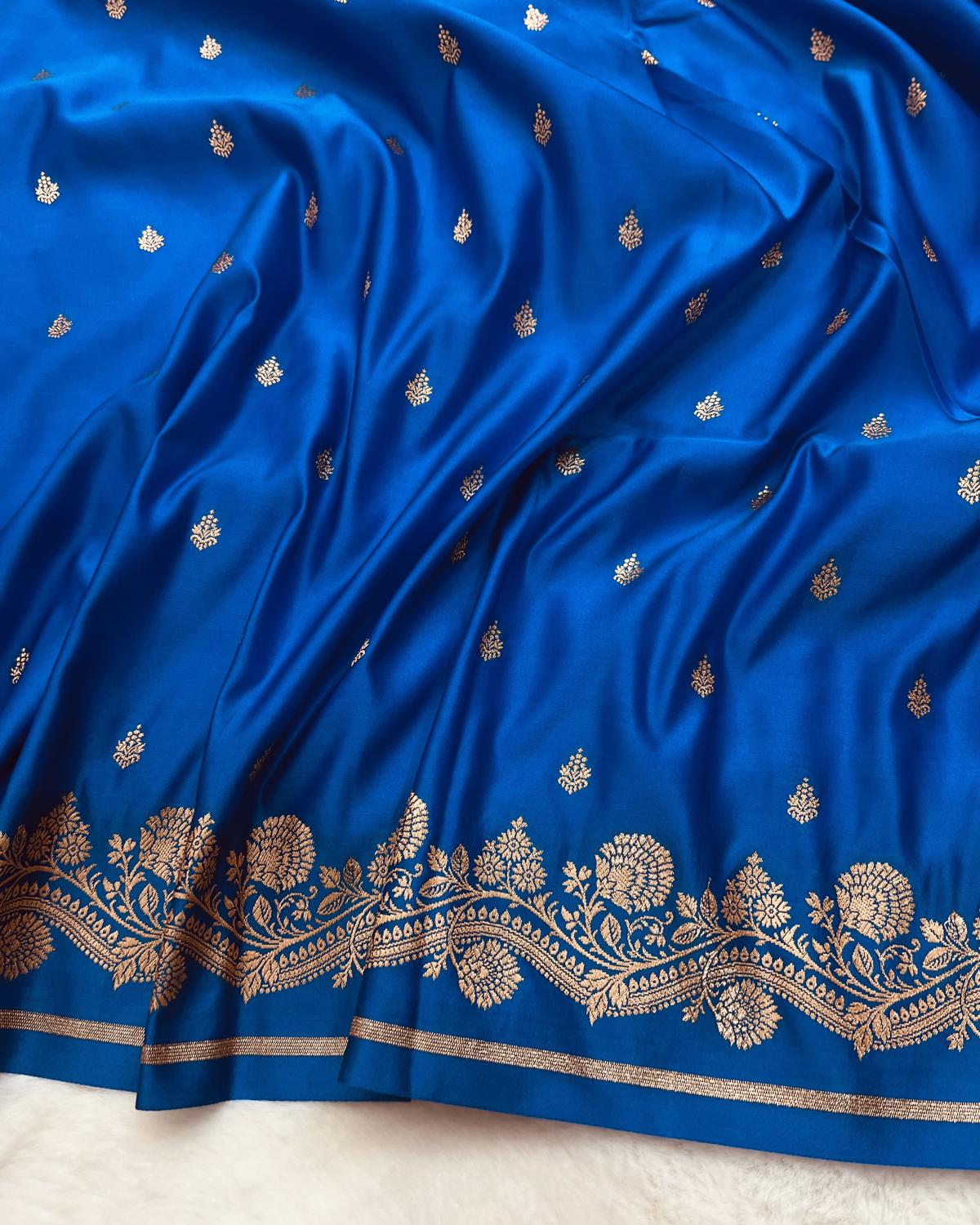 Soft luxurious blue Banarasi silk fabric witj beautiful golden zar buti detailing-Niyarah