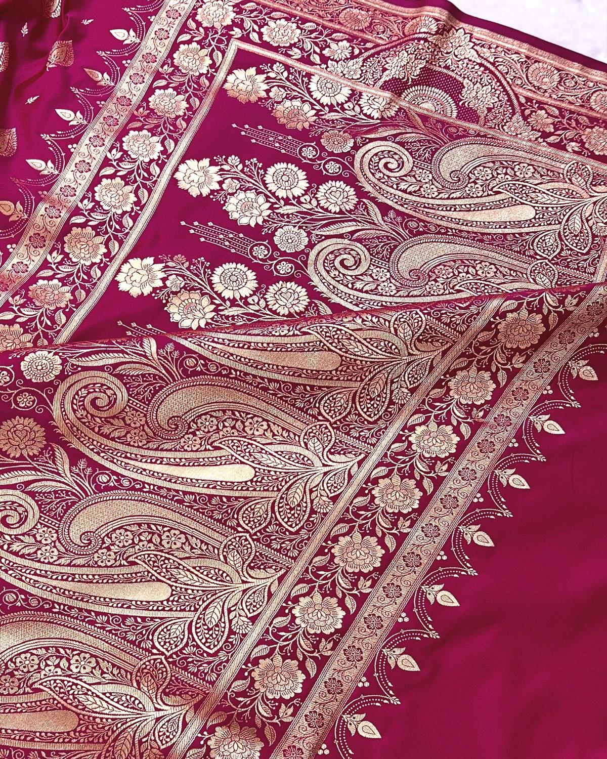 Close-up of floral golden zari work on pallu of rani pink banarasi saree