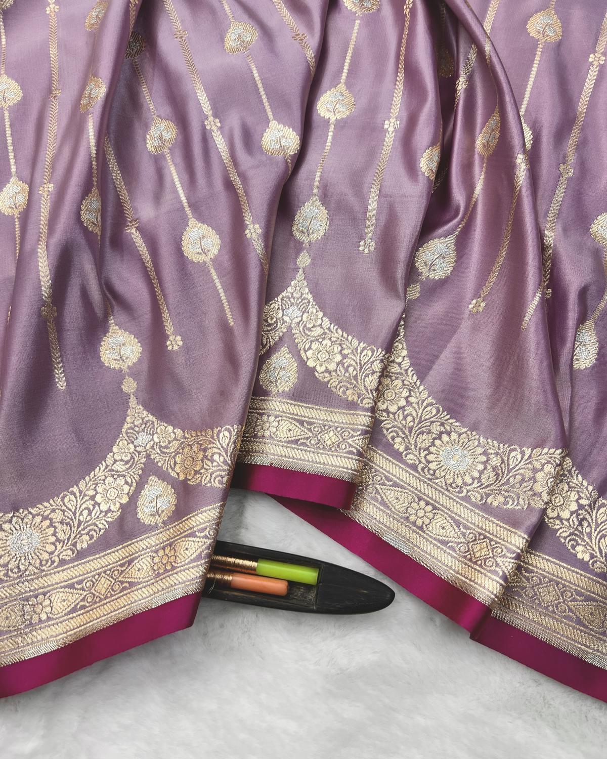 Lavender banarasi silk saree with striped silver and gold zari work for festive occasions-Niyarah | Buy banarasi saree online